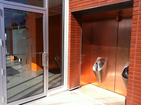 No-flush urinals outside the glass-walled public toilets on Whyte Ave.
