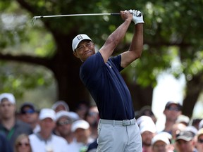 Tiger Woods plays his shot from the fourth tee during the first round of the Masters at Augusta National Golf Club on April 11, 2019 in Augusta, Georgia. (David Cannon/Getty Images)