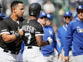Jose Abreu, left, of the White Sox holds back teammate Tim Anderson during an altercation with the Royals in the 6th inning at Guaranteed Rate Field in Chicago on Wednesday, April 17, 2019.