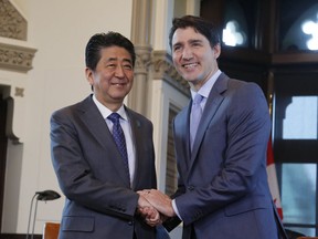 Japanese Prime Minister Shinzo Abe and Canadian Prime Minister Justin Trudeau take part in a welcoming ceremony on Parliament Hill in Ottawa on Sunday, April 28, 2019. (THE CANADIAN PRESS/ Patrick Doyle)