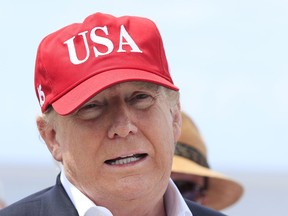 U.S. President Donald Trump speaks to reporters during a visit to Lake Okeechobee and Herbert Hoover Dike at Canal Point, Fla., March 29, 2019.