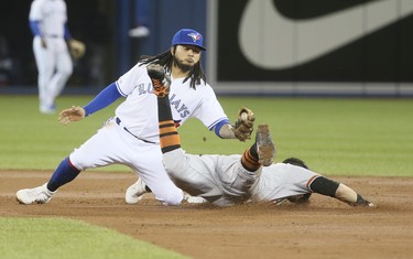 Toronto Blue Jays shortstop Freddy Galvis (16) tags Baltimore Orioles third baseman Renato Nunez (39) out at second against the Baltimore Orioles  in Toronto, Ont. on Wednesday April 3, 2019. Veronica Henri/Toronto Sun/Postmedia Network