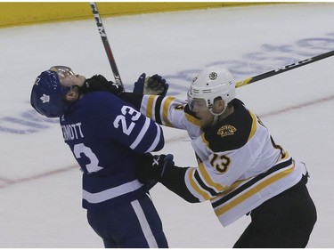 Toronto Maple Leafs defenseman Travis Dermott (23) and Boston Bruins center Charlie Coyle (13) on Sunday April 21, 2019 in Toronto. The Toronto Maple Leafs hosted the Boston Bruins in Game 6 of the best-of-7 Eastern Conference First Round at Scotiabank Arena Veronica Henri/Toronto Sun/Postmedia Network