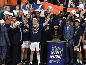The Virginia Cavaliers celebrate their 85-77 win over the Texas Tech Red Raiders to win the the 2019 NCAA men's Final Four National Championship game at U.S. Bank Stadium in Minneapolis, Minn. on Monday (Getty Images)