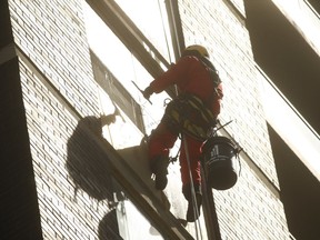 Sky High Windows Services employee Francis descends a 40-storey apartment building, near Islington Ave. and Bloor St. W., with ease using Rope Access safety technology on Wednesday, April 17, 2019. (Jack Boland/Toronto Sun/Postmedia Network)