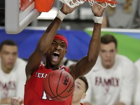 Texas Tech forward Tariq Owens dunks the ball against Virginia in the championship game of the Final Four in Minneapolis last night. (AP)