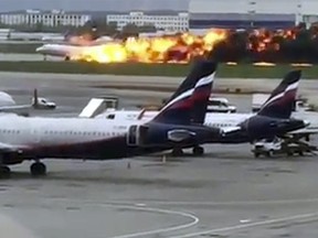 This image taken from video provided by Instagram user @artempetrovich, shows the SSJ-100 aircraft of Aeroflot Airlines on fire during an emergency landing in Sheremetyevo airport in Moscow, Russia, Sunday, May 5, 2019. (@artempetrovich via AP)