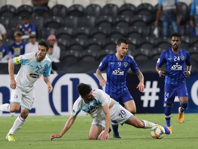Hilal's Sebastian Giovinco vies for the ball with Esteghlal's Mohammad Daneshgar during their game last month. (GETTY IMAGES)