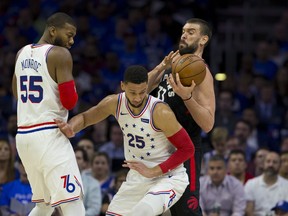 Philadelphia 76ers' Ben Simmons (centre) was fined on Friday for elbowing Toronto's Kyle Lowry. (GETTY IMAGES)