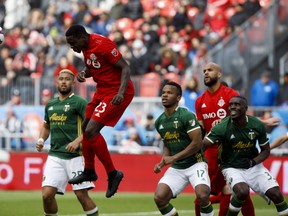 Toronto FC defender Chris Mavinga heads the ball during a match last month. (THE CANADIAN PRESS)
