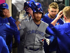 Brandon Drury of the Toronto Blue Jays is greeted in the dugout after hitting a solo home run in the fifth inning of the game against the Los Angeles Angels of Anaheim at Angel Stadium of Anaheim on April 30, 2019 in Anaheim, California. (Photo by Jayne Kamin-Oncea/Getty Images)