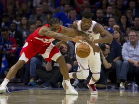 Kawhi Leonard of the Toronto Raptors and Jimmy Butler of the Philadelphia 76ers fight for the ball in the fourth quarter of Game 4 of the Eastern Conference semifinal at the Wells Fargo Center on May 5, 2019 in Philadelphia, Pennsylvania. The Raptors defeated the 76ers 101-96.  (Photo by Mitchell Leff/Getty Images)