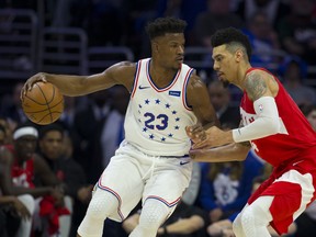76ers’ Jimmy Butler (left) looks to make a move against the Raptors’ Danny Green during Philadelphia’s Game 6 win on Thursday. The Raptors will have to do a better job of containing Butler in Sunday’s winner-take-all game.  Getty Images