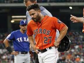 Jose Altuve of the Houston Astros leaves the game in the first inning against the Texas Rangers at Minute Maid Park on May 10, 2019 in Houston, Texas, after hurting his hamstring running to first base..  (Photo by Tim Warner/Getty Images)