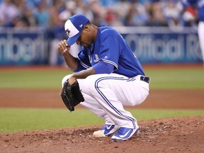 Edwin Jackson #33 of the Toronto Blue Jays reacts after giving up a grand slam home run in the fourth inning during MLB game action to Austin Hedges #18 of the San Diego Padres at Rogers Centre on May 25, 2019 in Toronto, Canada.