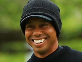 Tiger Woods smiles on the practice green during a practice round prior to the 2019 PGA Championship at the Bethpage Black course on May 14, 2019 in Bethpage, New York. (Mike Ehrmann/Getty Images)