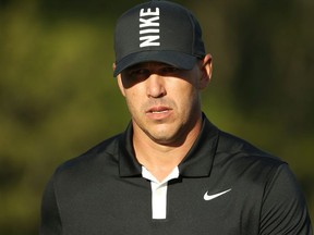 Brooks Koepka of the United States reacts to his putt during the third round of the 2019 PGA Championship at the Bethpage Black course on May 18, 2019 in Farmingdale, New York.