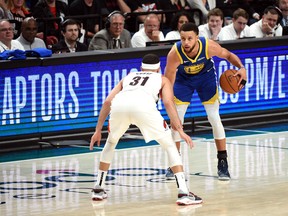 Warriors’ Stephen Curry (right) dribbles against brother Seth of the Trail Blazers during their semifinal series.  Getty IMages