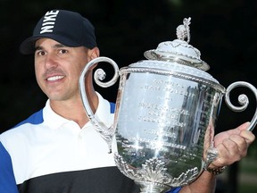Brooks Koepka of the United States poses with the Wanamaker Trophy during the Trophy Presentation Ceremony after winning the final round of the 2019 PGA Championship at the Bethpage Black course on May 19, 2019 in Farmingdale, New York.