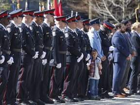 Toronto Police officers stand at attention at the 20th annual Ontario Police Memorial Foundation ceremony at Queens Park on May 5, 2019. (Jack Boland, Toronto Sun)