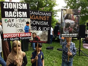 Signs displayed at an al-Quds Day rally at Queen's Park on June 9 2018. (Courtesy Canada-Israel Friendship Association)