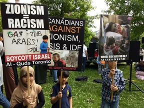 Signs displayed at an Al Quds Day rally at Queens Park on June 9 2018. (Courtesy Canada-Israel Friendship Association)