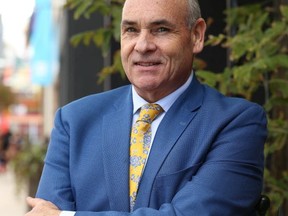 George Smitherman poses while running for city council last fall. (Jack Boland, Toronto Sun)