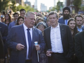 Ontario Premier Doug Ford and Toronto Mayor John Tory during a vigil along the Danforth in Toronto, Ont. on Wednesday July 25, 2018.