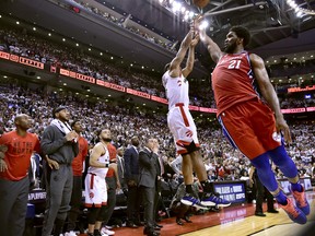 Philadelphia 76ers centre Joel Embiid fails to stop Raptors forward Kawhi Leonard's game-winning shot on Sunday night. (THE CANADIAN PRESS)