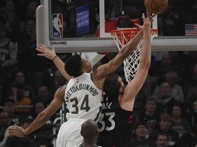 Milwaukee Bucks' Giannis Antetokounmpo blocks the shot of Toronto Raptors' Marc Gasol during Game 2 on Friday. (AP PHOTO)