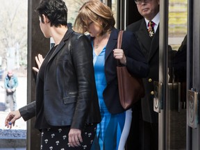 Vice-Admiral Mark Norman walks with his lawyers Marie Henein and Christine Mainville as they leave court in Ottawa on Wednesday, May 8, 2019.