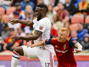 Toronto FC forward Jozy Altidore and Real Salt Lake defender Justen Glad fight for the ball during last week's game. (AP PHOTO)