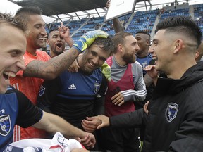 San Jose Earthquakes forward Chris Wondolowski (centre), celebrates with teammates after last week's win over Chicago. (AP PHOTO)