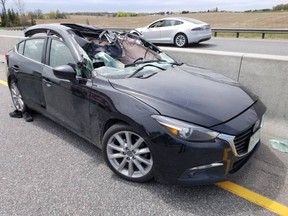 A car was demolished and a man critically injured when a tire from an oncoming vehicle flew through his windshield on Hwy. 400, near Hwy. 89, in innisfil on Saturday, May 18, 2019. (Photo from @OPP_HSD on Twitter)