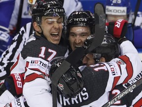 Canada's Mark Stone, centre, celebrates with teammates after scoring his sides sixth goal during the Ice Hockey World Championships group A match between Slovakia and Canada at the Steel Arena in Kosice, Slovakia, Monday, May 13, 2019. (AP Photo/Petr David Josek)