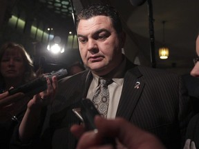 Then Conservative MP Dean Del Mastro speaks to the media in the House of Commons at Parliament Hill in Ottawa Nov 14, 2011. (Postmedia files)