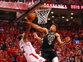 Giannis Antetokounmpo of the Milwaukee Bucks blocks a shot by Kawhi Leonard of the Toronto Raptors during Game 6 of the Eastern Conference finals on Saturday night at Scotiabank Arena. (Gregory Shamus/Getty Images)