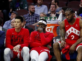 Raptors’ Jeremy Lin (left), Pascal Siakam (centre) and Kawhi Leonard look dazed and confused on the bench during the late stages of Game 6 against the 76ers on Thursday night in Philadelphia. Game 7 goes Sunday night in Toronto. (AP PHOTO)