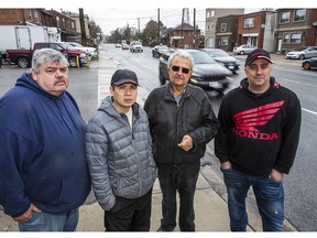 Business owners and residents are not happy with the proposed bike lanes in front of their businesses and homes along Scarlett Rd., just north of St. Clair Ave. W.,  on Friday May 3, 2019. From left are - Robert Allen -  owner operator, Humber Valley Produce,  Qui Chau - owner of Truspeers Garden & Florist, Gus Anagnos owner Delta Interiors, and Marco Sepe owner/resident BSC Moto Inc.