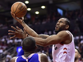 Toronto Raptors forward Kawhi Leonard (2) goes to the net as Philadelphia 76ers forward James Ennis III (11) defends during second half, second round NBA basketball playoff action in Toronto, on Monday, April 29, 2019. THE CANADIAN PRESS/Frank Gunn ORG XMIT: FNG523
