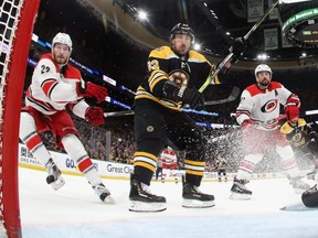 Bruins forward Brad Marchand (centre) moves in against the Hurricanes in Game 1 of the NHL's Eastern Conference Final at TD Garden in Boston on Thursday, May 9, 2019.