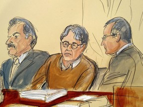 In this courtroom drawing, defendant Keith Raniere (center) sits between his attorneys Paul DerOhannesian (left) and Mark Agnifilo on the first day of the sex trafficking trial, Tuesday, May 7, 2019.