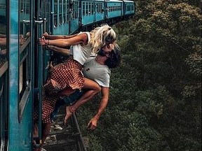 A Belgian couple known to Instagram as backpackdiariez posted a photo that showed them leaning out of a train, kissing, while travelling over a bridge in Sri Lanka.