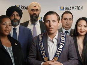 Brampton Mayor Patrick Brown, centre, and councillors appear in a video after voting to stay with Peel Region.