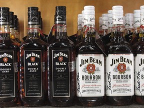 In this Jan. 13, 2014, file photo, Jim Beam bourbon bottles line the counter at the Jim Beam visitors' center at Clermont, Ky. (THE CANADIAN PRESS/AP/Bruce Schreiner)