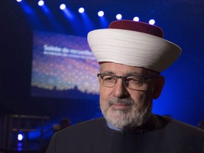 Imam Hassan Guillet arrives at a gathering at the Pavillon de la Jeunesse, marking the first anniversary of the mosque shooting, Sunday, January 28, 2018 in Quebec City.