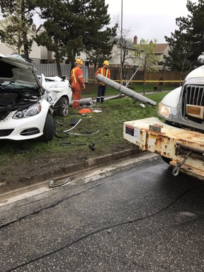 Hydro crews deal with a light pole that was toppled when a white Mercedes with three teens crashed on Brimley Rd. in Scarborough May 10, 2019. TrafficServices/Twitter