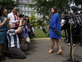 White House press secretary Sarah Sanders speaks with reporters outside the White House, Friday, May 3, 2019, in Washington.