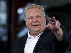 Ontario Premier Doug Ford speaks during an announcement in the the mock-up facility at the Darlington Power Complex, in Bowmanville, Ont., Friday, May 31, 2019. (THE CANADIAN PRESS/Cole Burston)