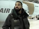 Drake standing in front of his new private plane.  (instagram.com/champagnepapi)